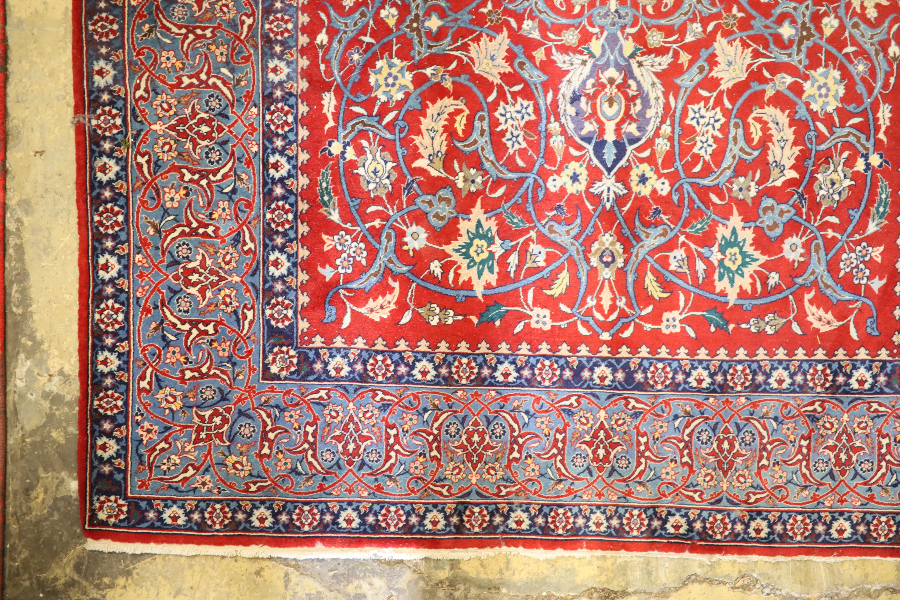 An Isfahan red ground rug, 169 x 110cm